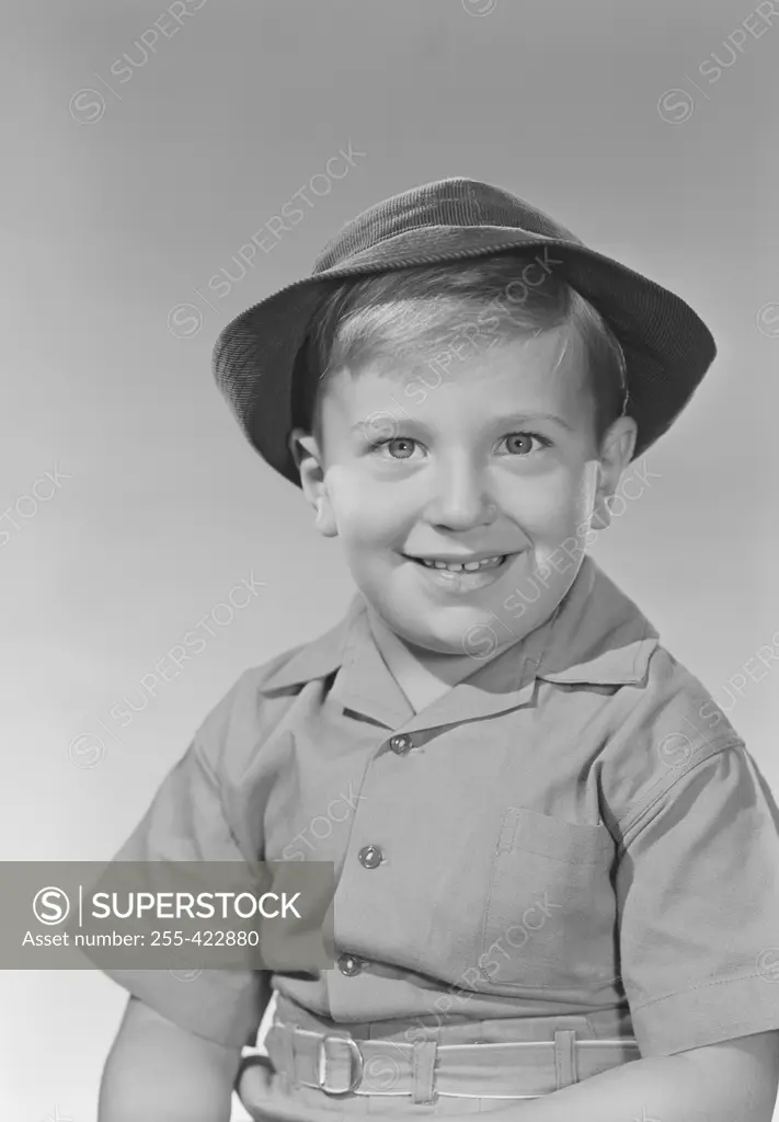 Studio portrait of boy in boy scout uniform