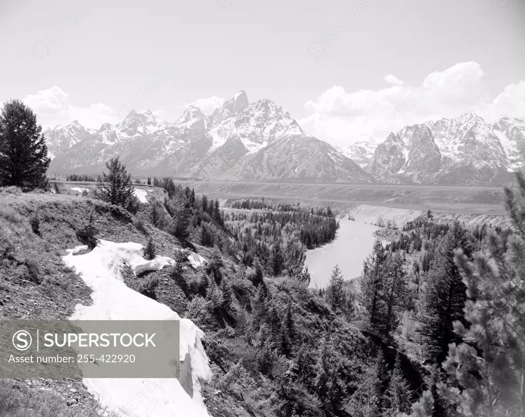 USA, Wyoming, melting snow near Snake river and Grand Teton in background