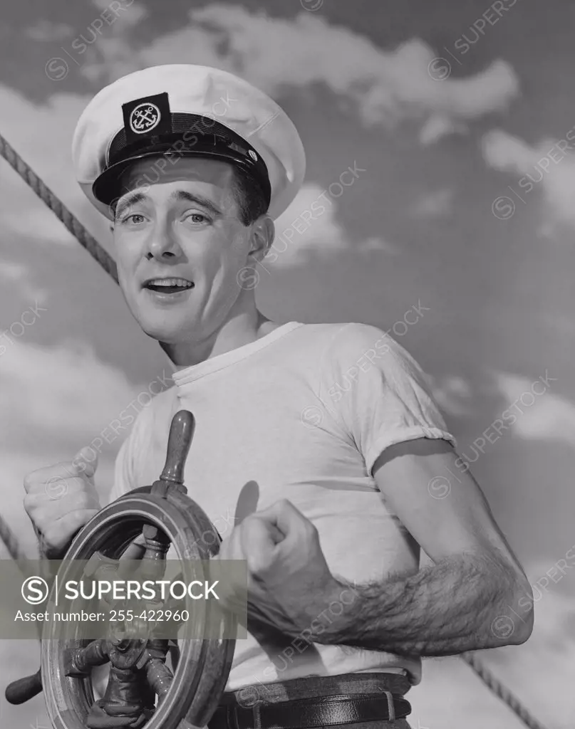 Portrait of sailor steering ship