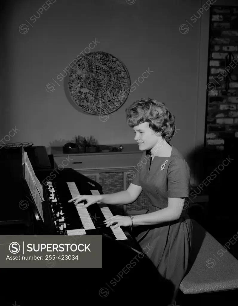 Teenage girl playing organ