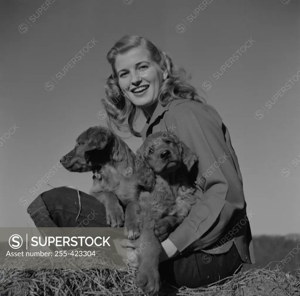 Young woman with cocker spaniels