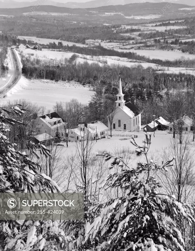 USA, Vermont,  Waterford, snow covered pines and church