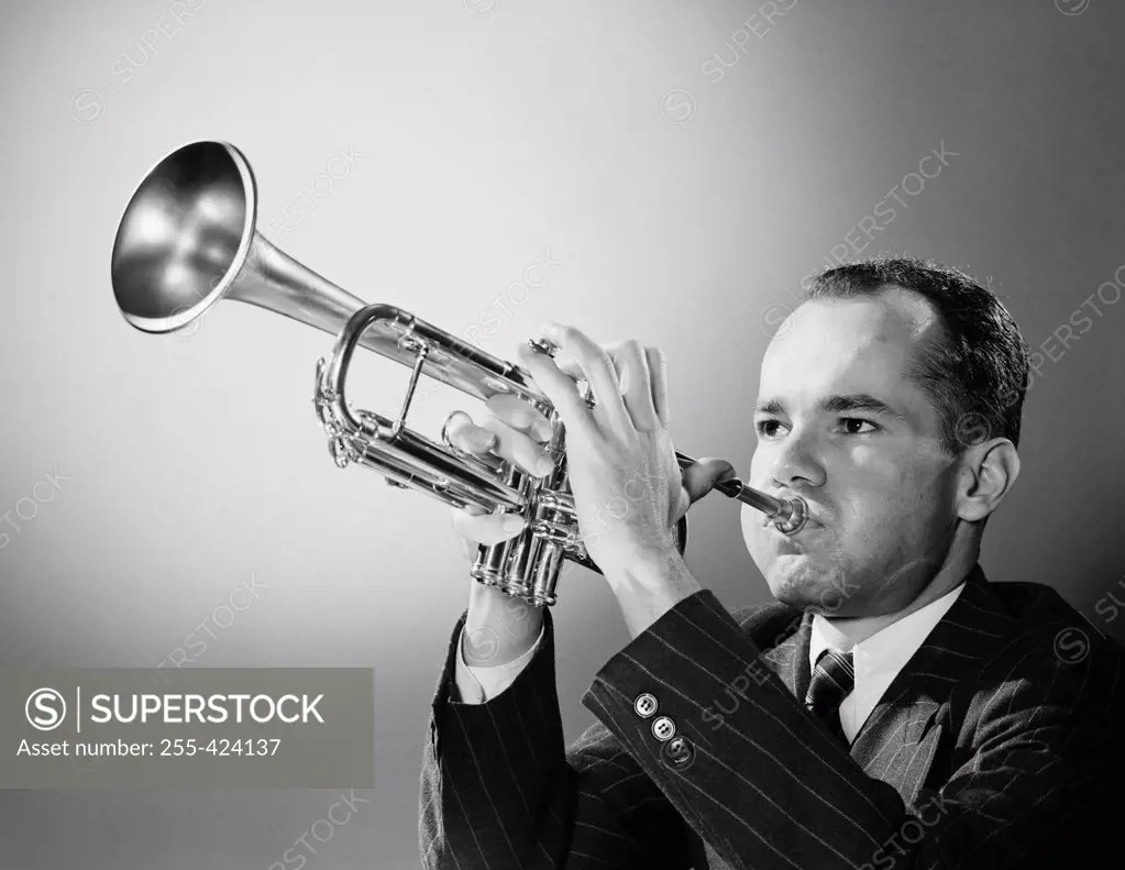 Young man playing trumpet
