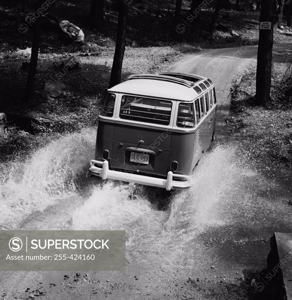 USA, New Jersey, Van in flood water on country road
