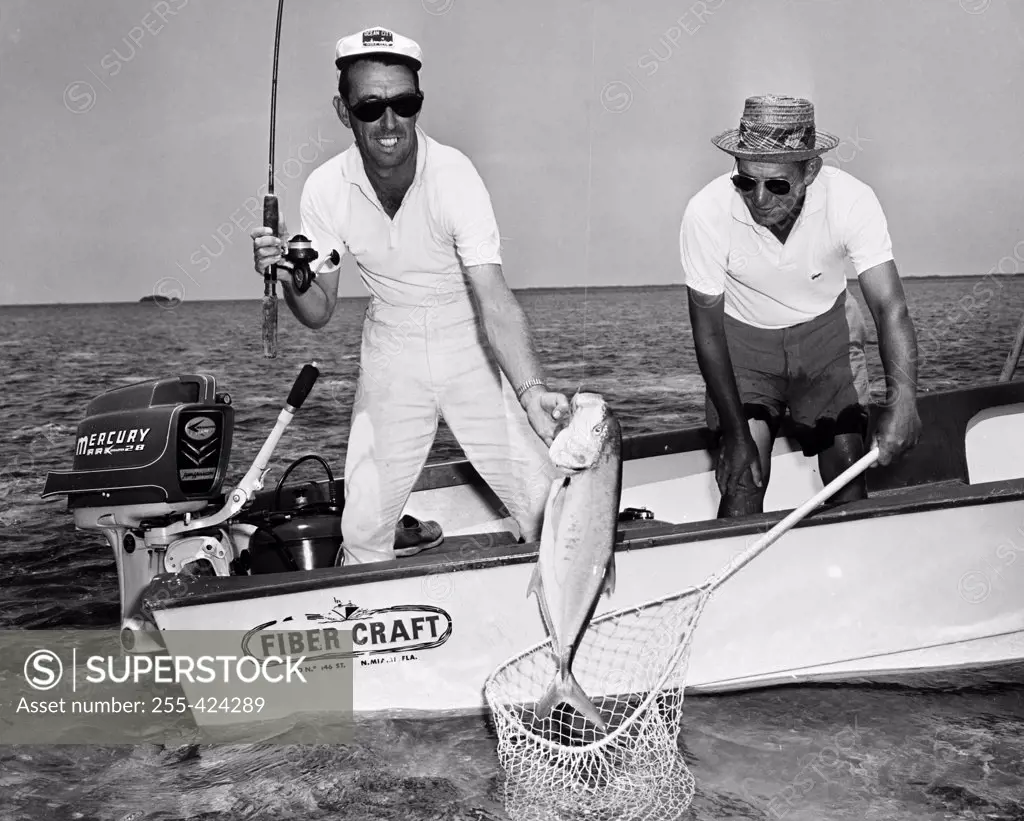 USA, Florida, Marquesas Key, Fishermen landing Bar Jack fish