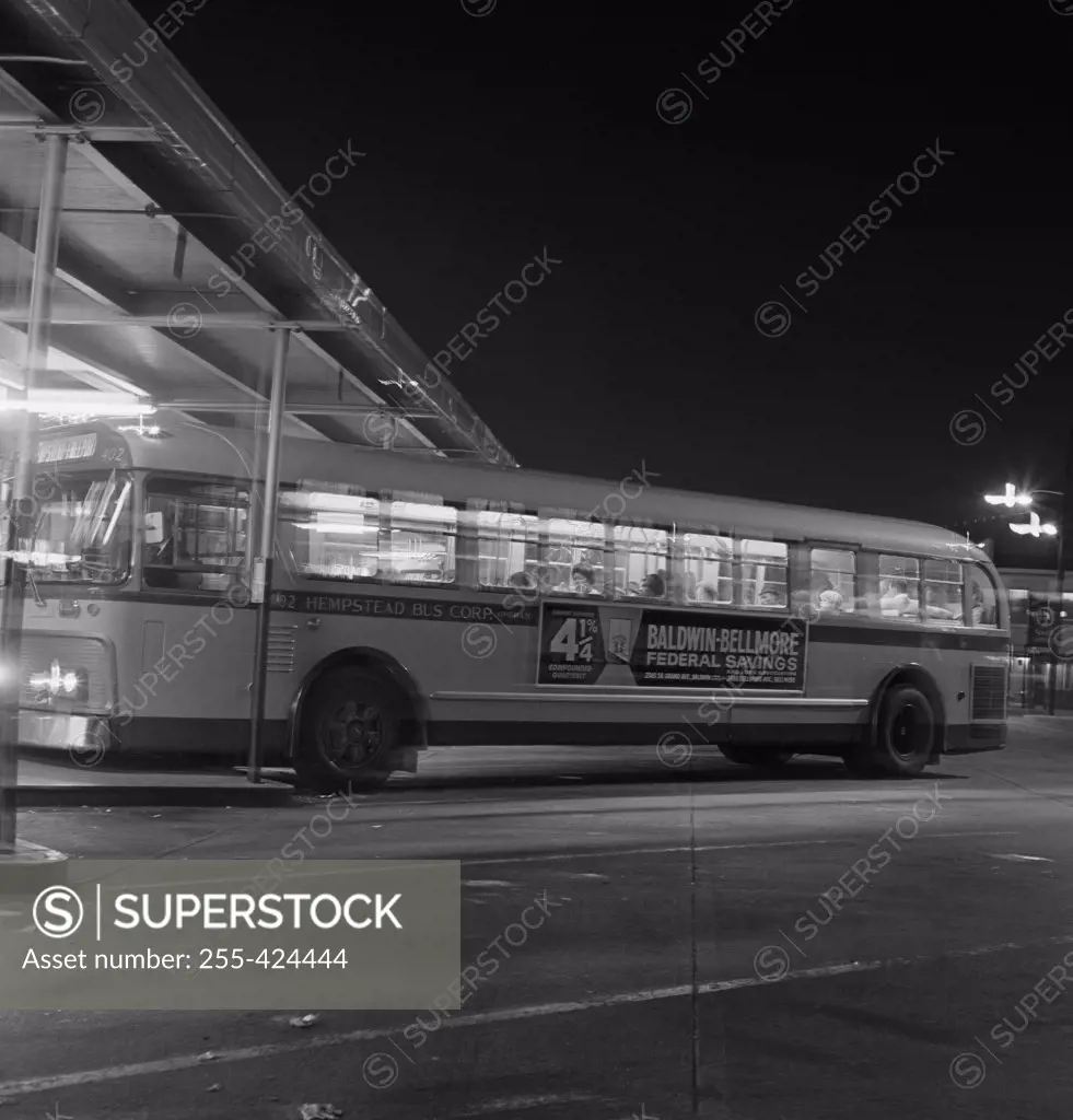 Side view of bus at night