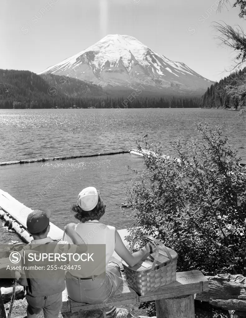 USA, Washington State, Mountain Saint Helens and Spirit Lake, mother and son looking at view