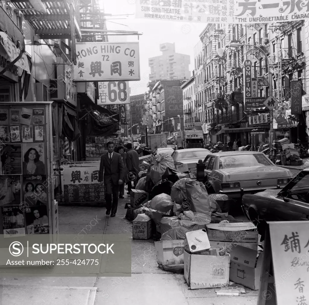 USA, New York, New York City, Garbage awaiting pick up n Chinatown street