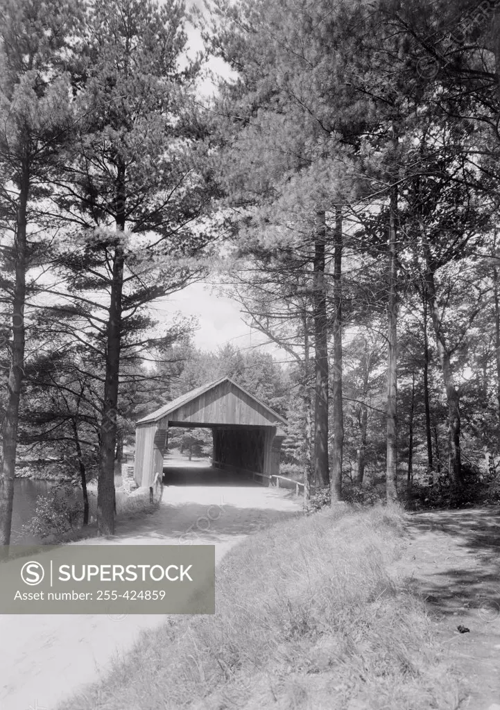 USA, Massachusetts, Old Sturbridge Village, view of one of covered bridges over Quinabog River