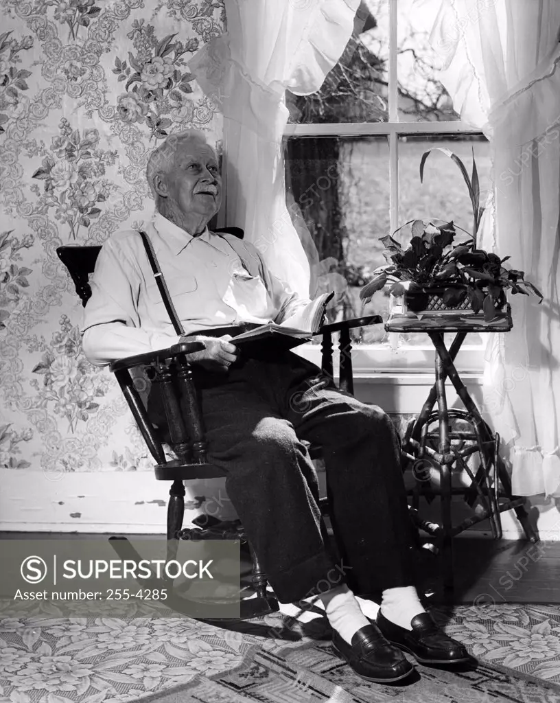 Senior man sitting in rocking chair