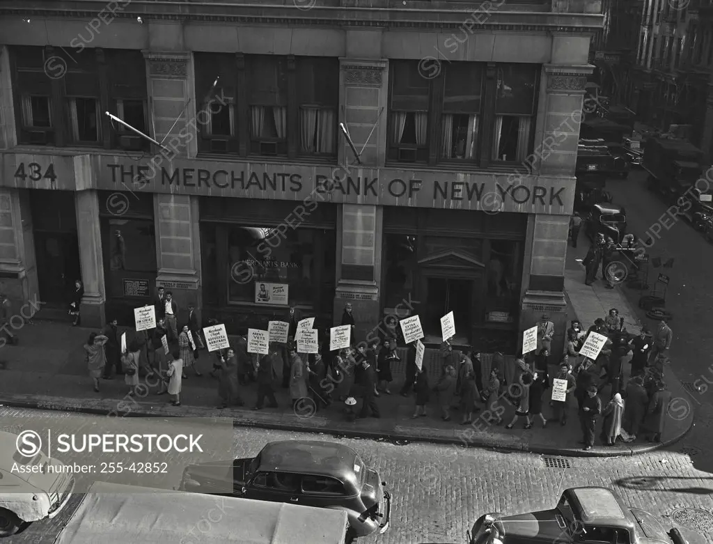 Vintage photograph. High angle view of protestors outside of Merchants Bank of New York