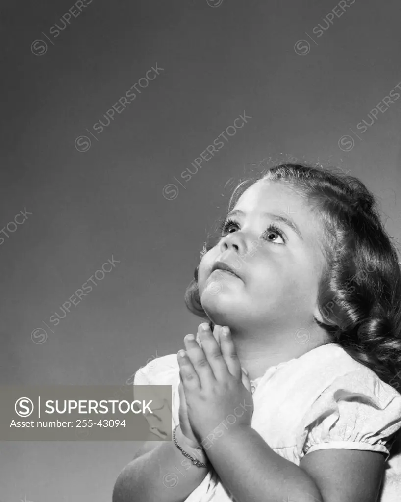 Close-up of a girl praying