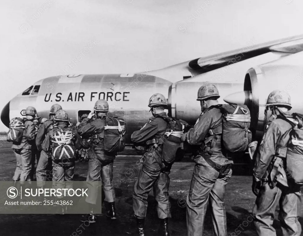 Group of paratroopers standing in a row near a military airplane, 101st Airborne Division, Fort Campbell, Kentucky, USA