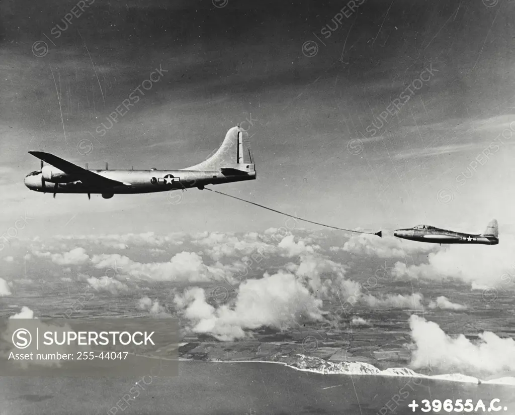 Vintage photograph. Air to air refueling of a USA fighter jet employing the British probe-drogue system