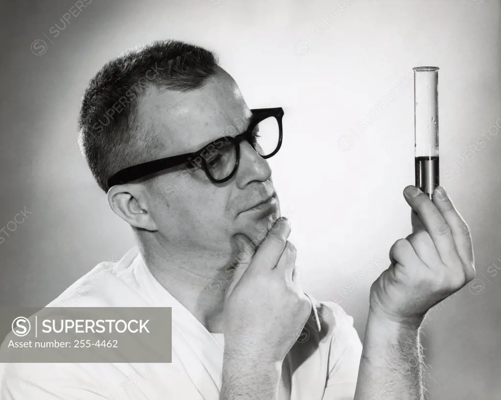Close-up of a male researcher holding a test tube
