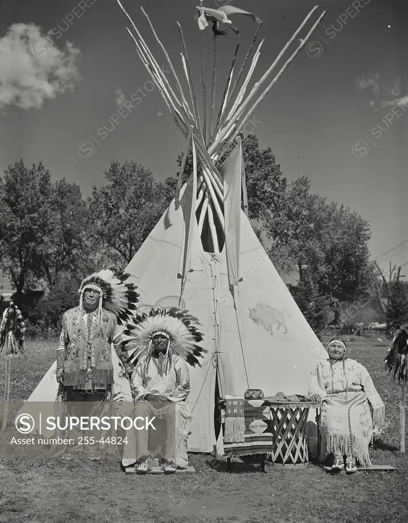 Vintage photograph. Native Americans selling beaded work, blankets, and other craft work