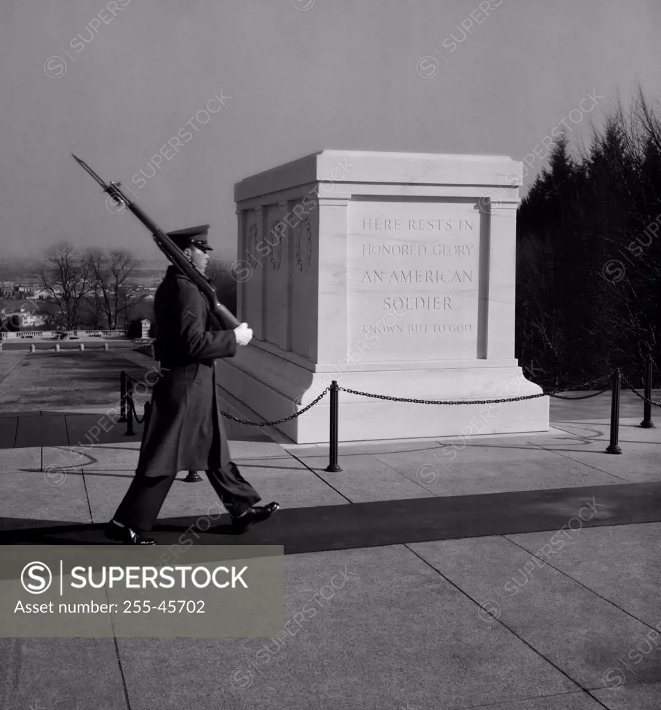 Army soldier walking near a memorial, Tomb of the Unknown Soldier, Arlington National Cemetery, Arlington, Virginia, USA