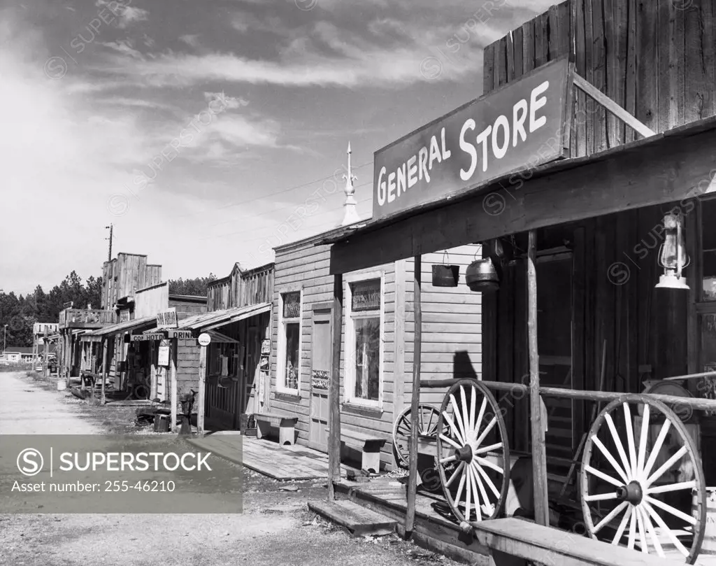 Wagon wheels in front of a store, Gold Town, Black Hills, South Dakota, USA