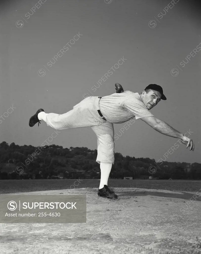 Vintage Photograph. Baseball player throwing a baseball