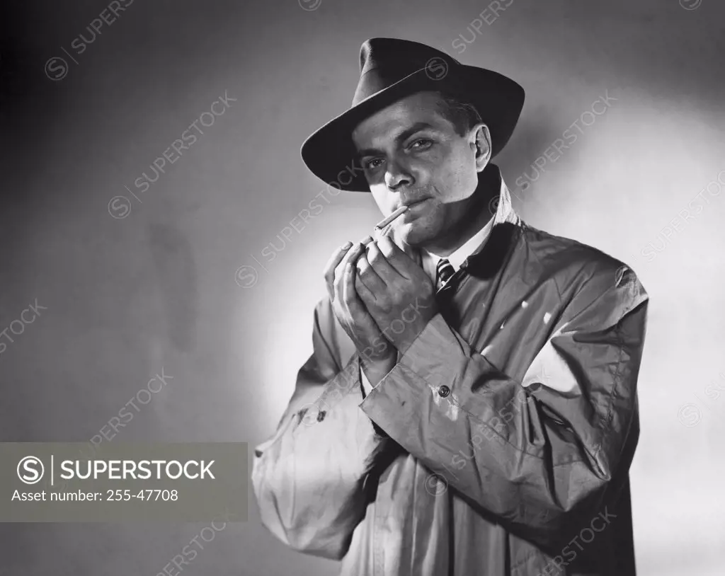 Portrait of a mid adult man smoking a cigarette