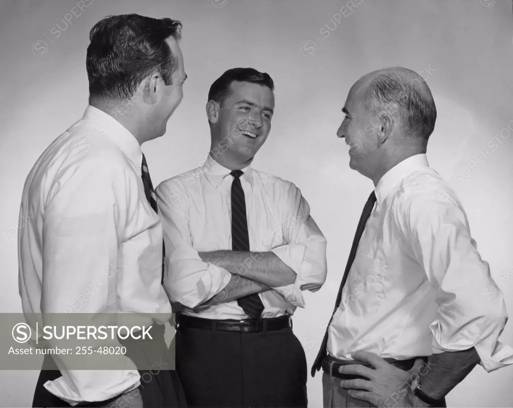 Three businessmen talking