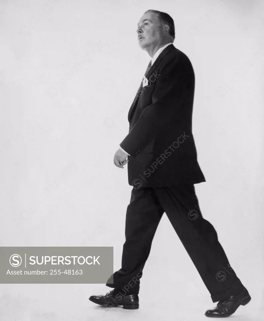 Side profile of businessman walking
