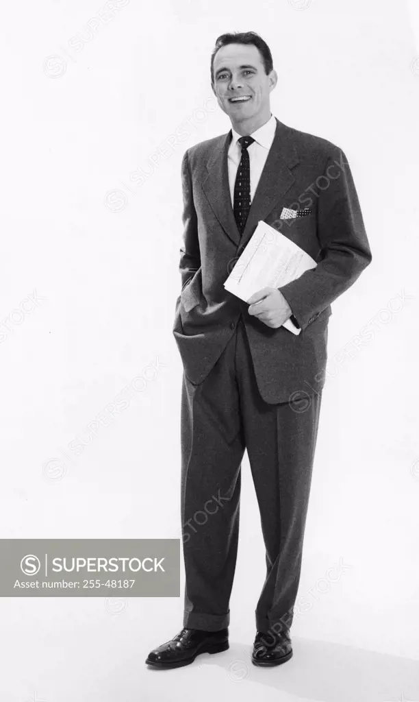 Portrait of a businessman standing with his hand in his pocket