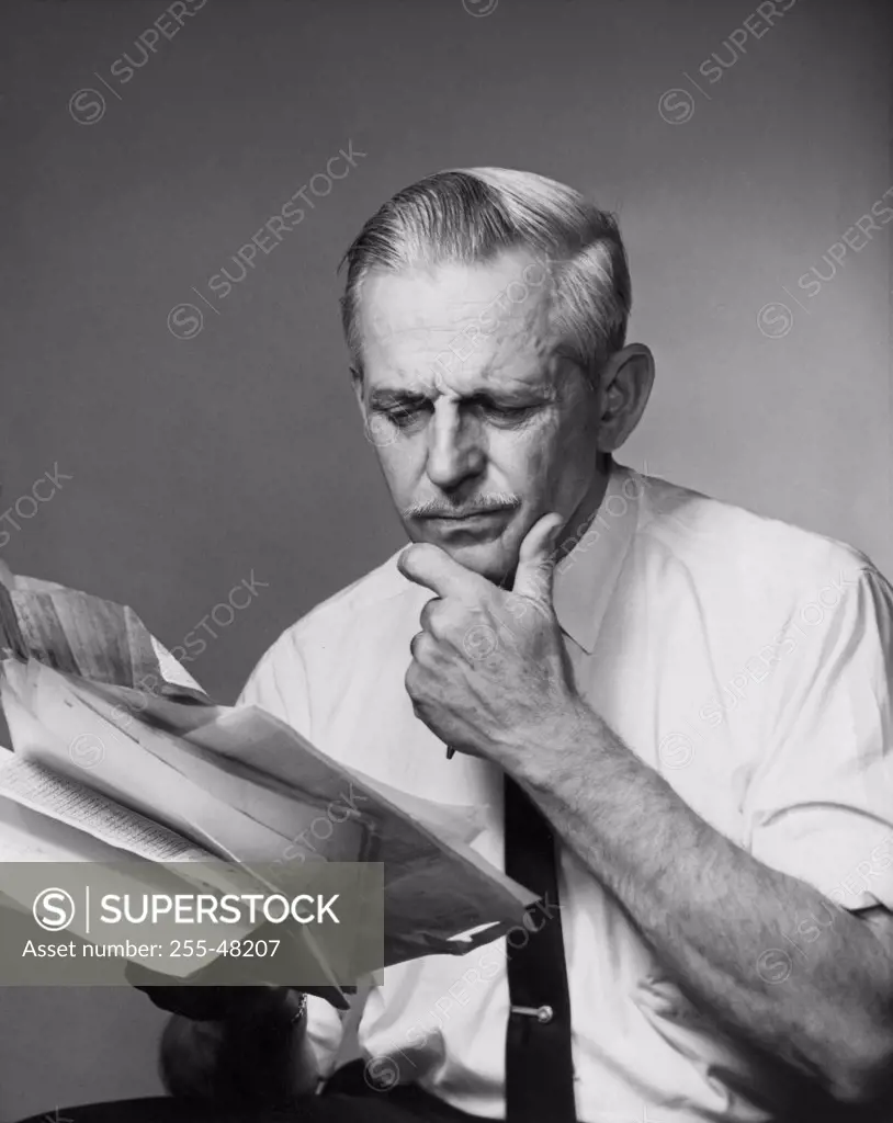 Senior businessman reading documents
