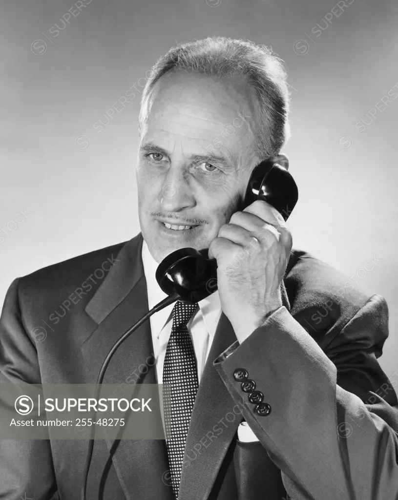 Close-up of businessman talking on the telephone