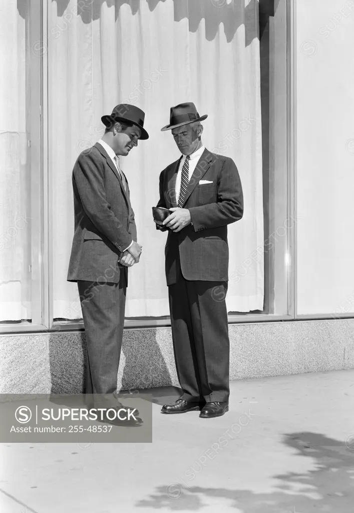 Businessmen talking in street