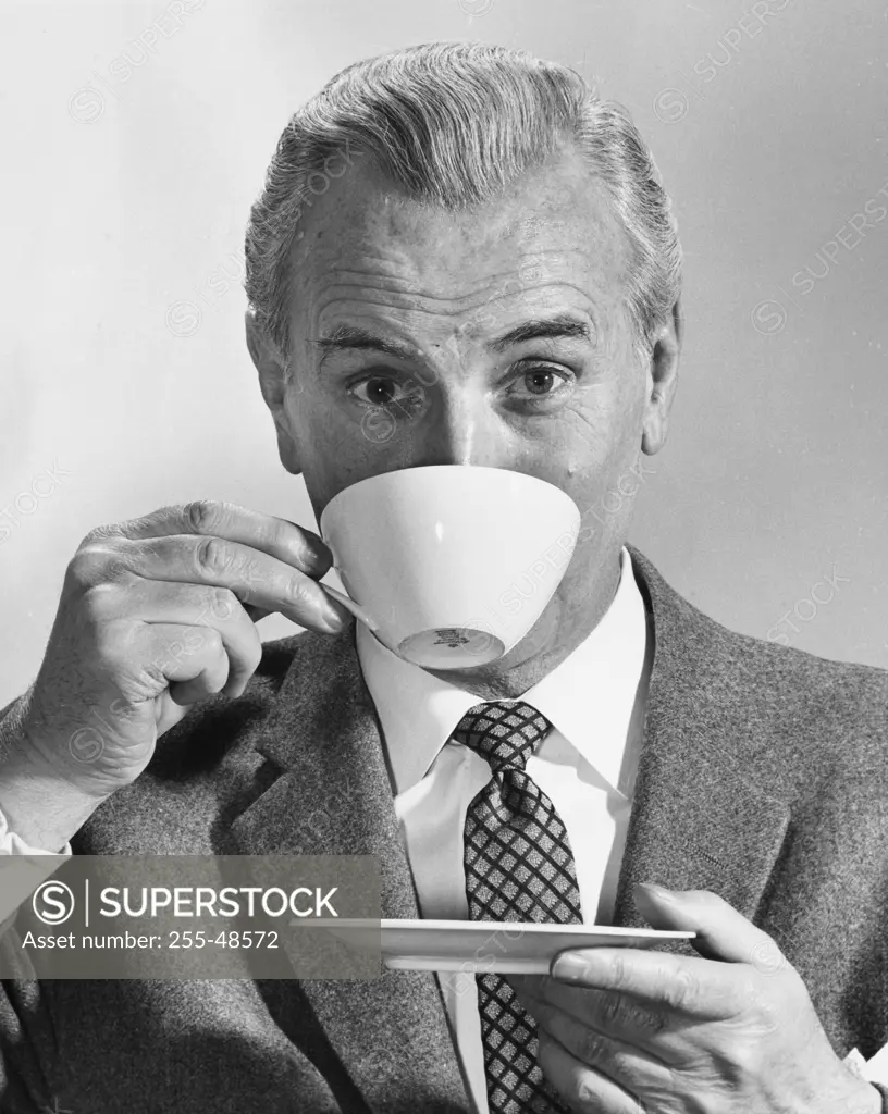 Portrait of a mature man drinking coffee