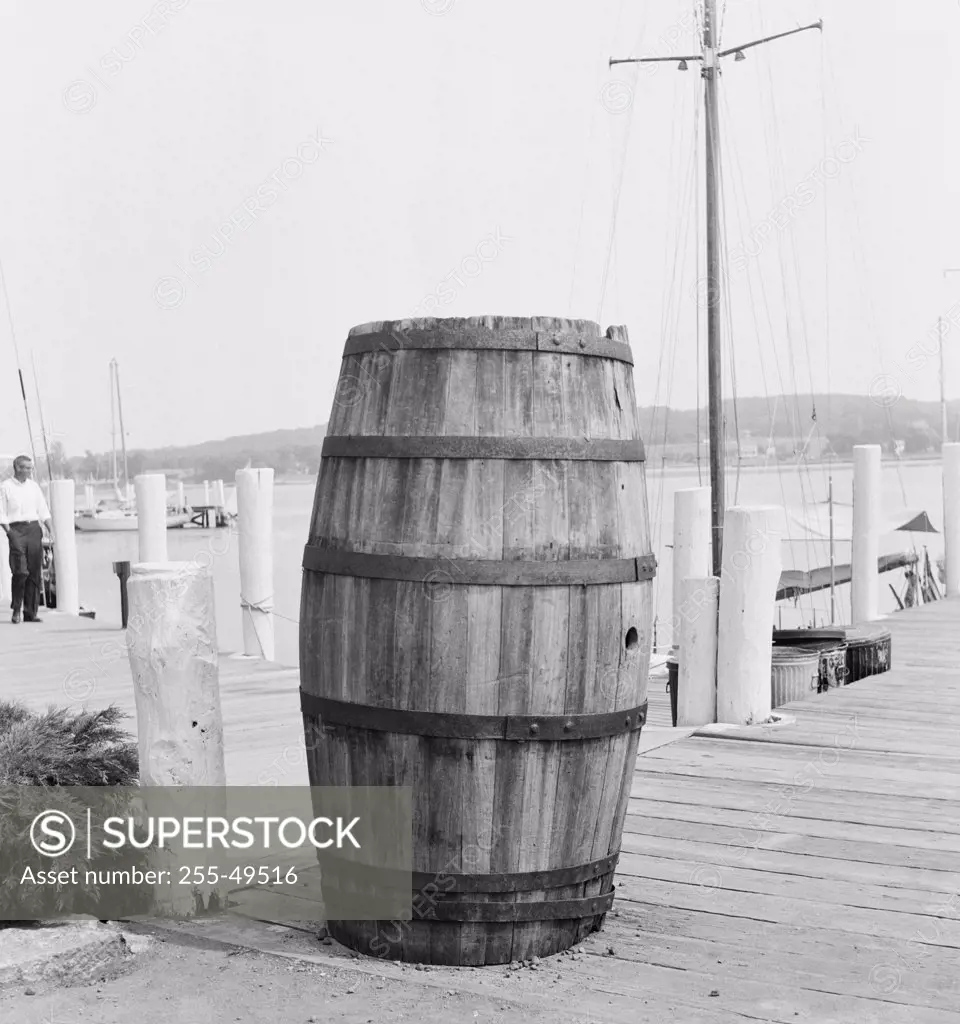 Close-up of a wooden barrel on a pier