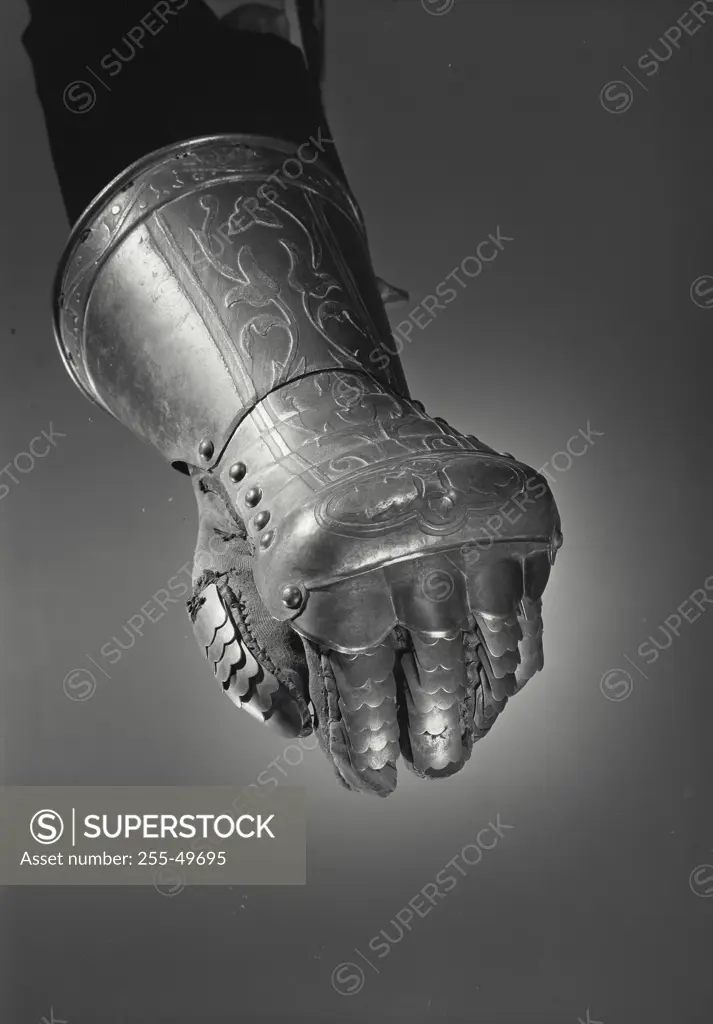 Vintage Photograph. Hand in metal gauntlet making fist