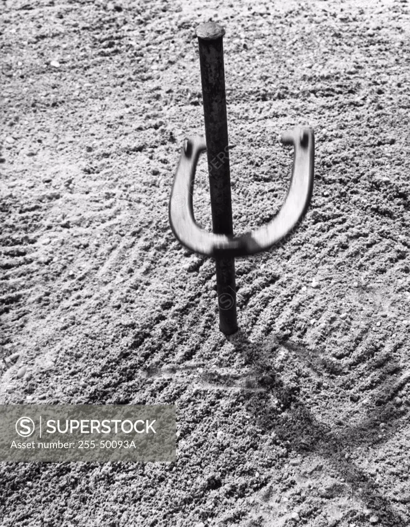 High angle view of a horseshoe on a stake
