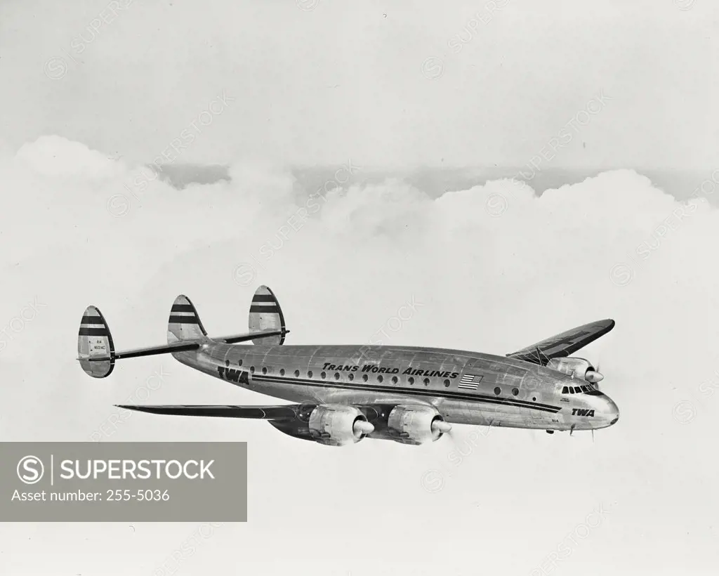 Vintage photograph. Side profile of TWA Constellation in flight
