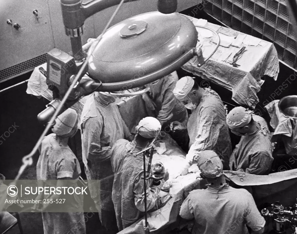 High angle view of a group of surgeons in an operating room