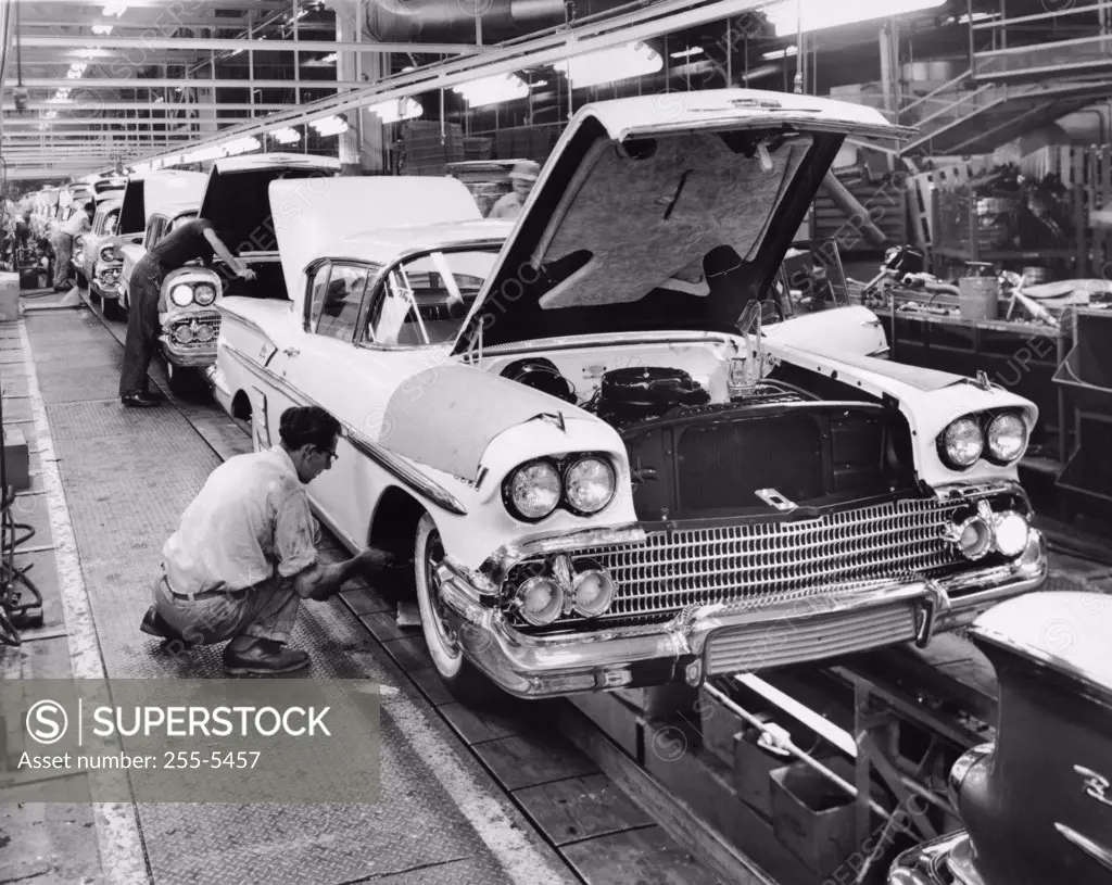 Workers working on assembly line of cars, Chevrolet Motor Division, Detroit, Michigan, USA
