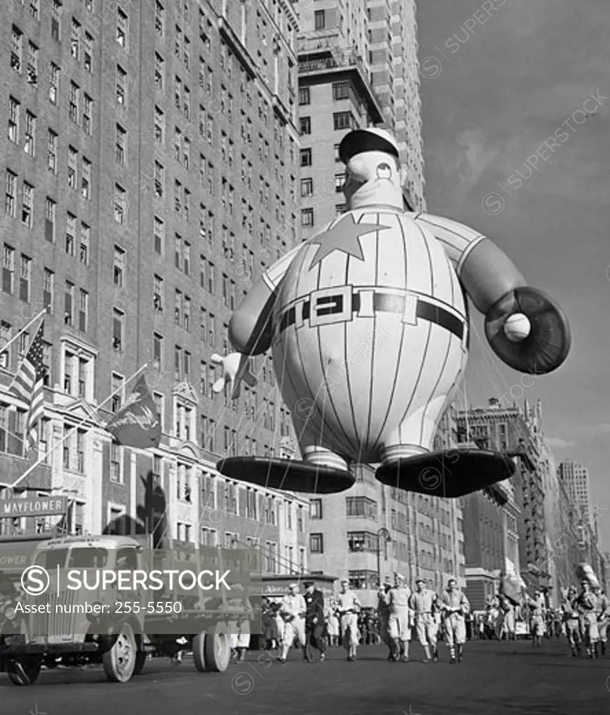 USA, New York State, New York City, Macy's Thanksgiving Day Parade holding baseball player balloon, 1946