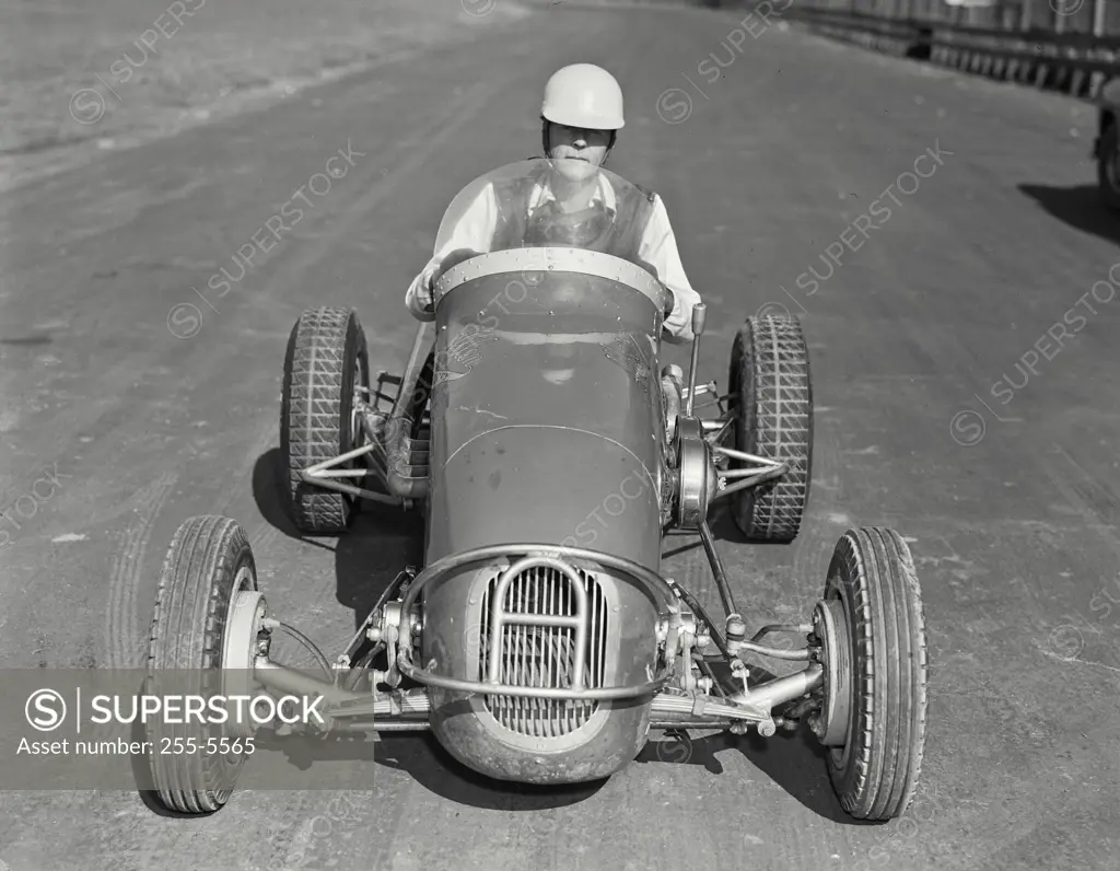 Vintage photograph. Man driving Allen Offy - Special midget auto racer