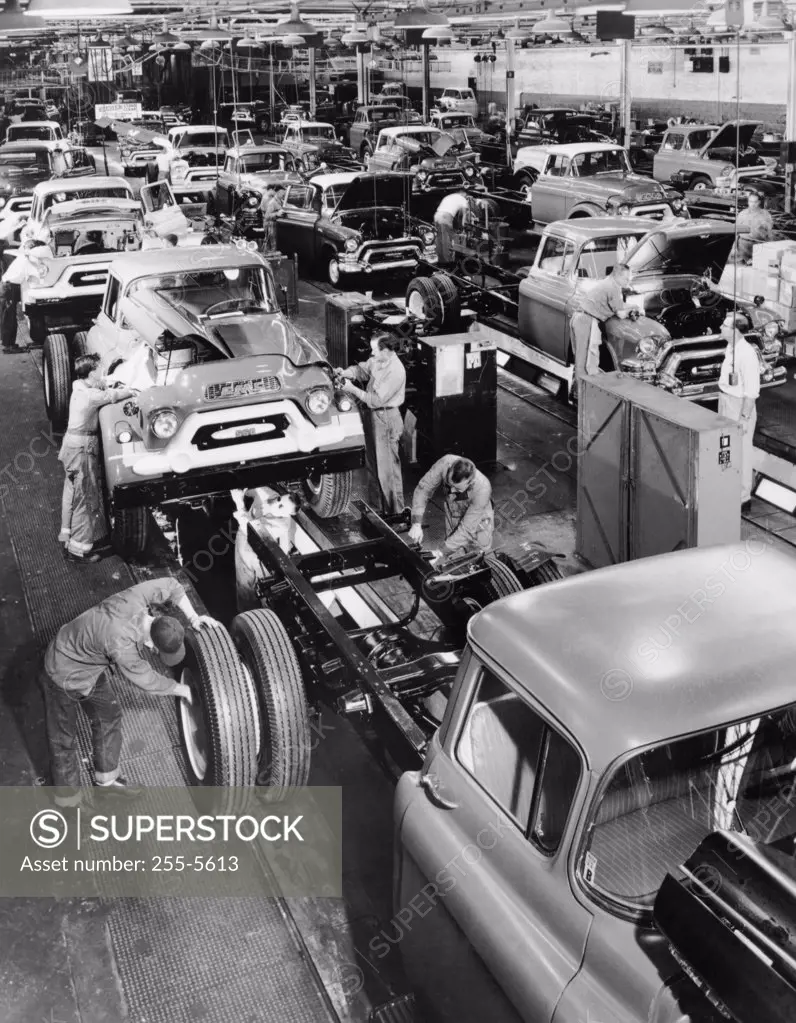 Trucks being assembled in an automobile manufacturing plant