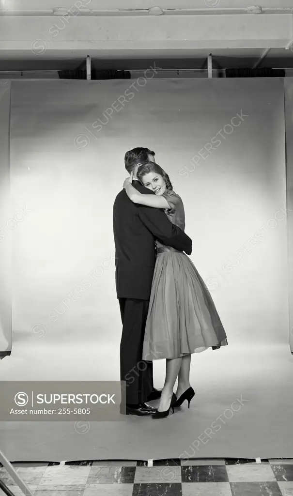 Vintage Photograph. Husband and wife hugging each other.