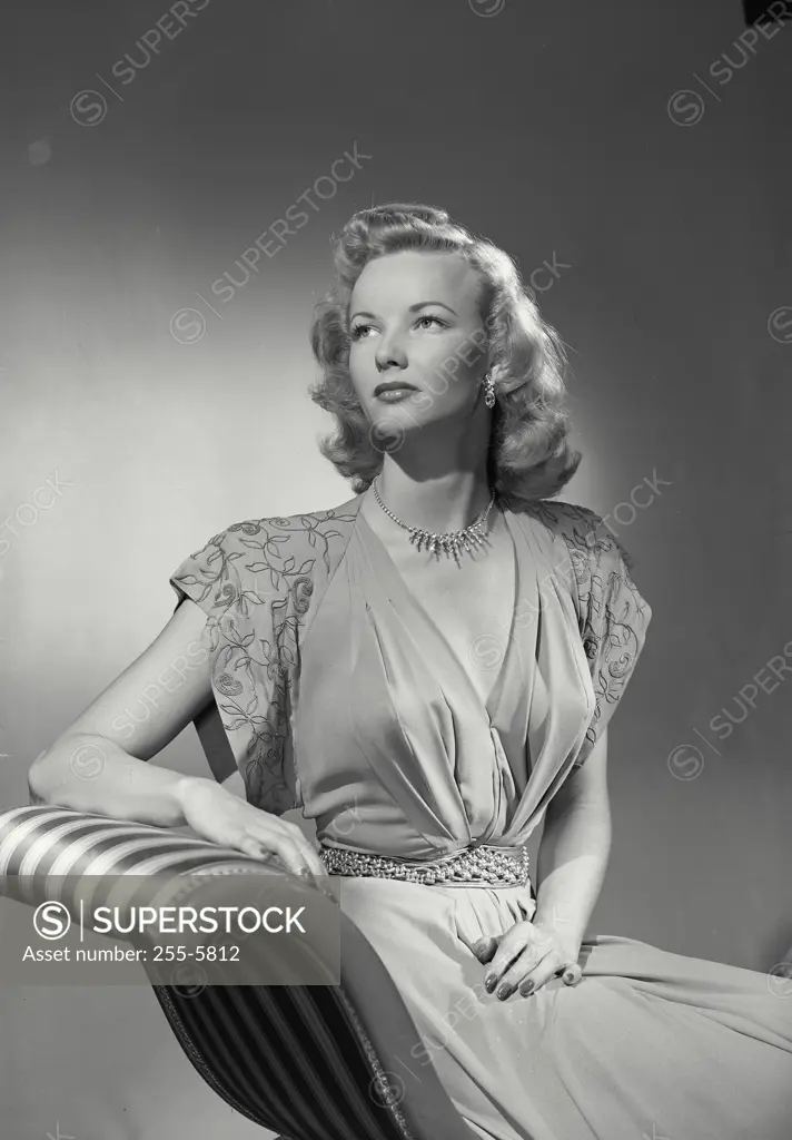 Vintage photograph. Woman in gown sitting in chair