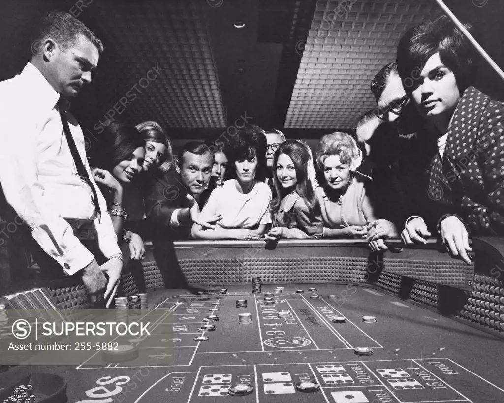 Group of people playing craps in a casino