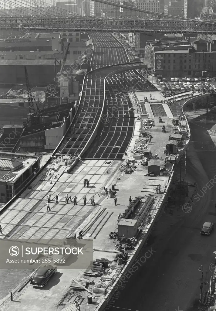 Vintage Photograph. Men seen constructing trainlines snaking through New York City