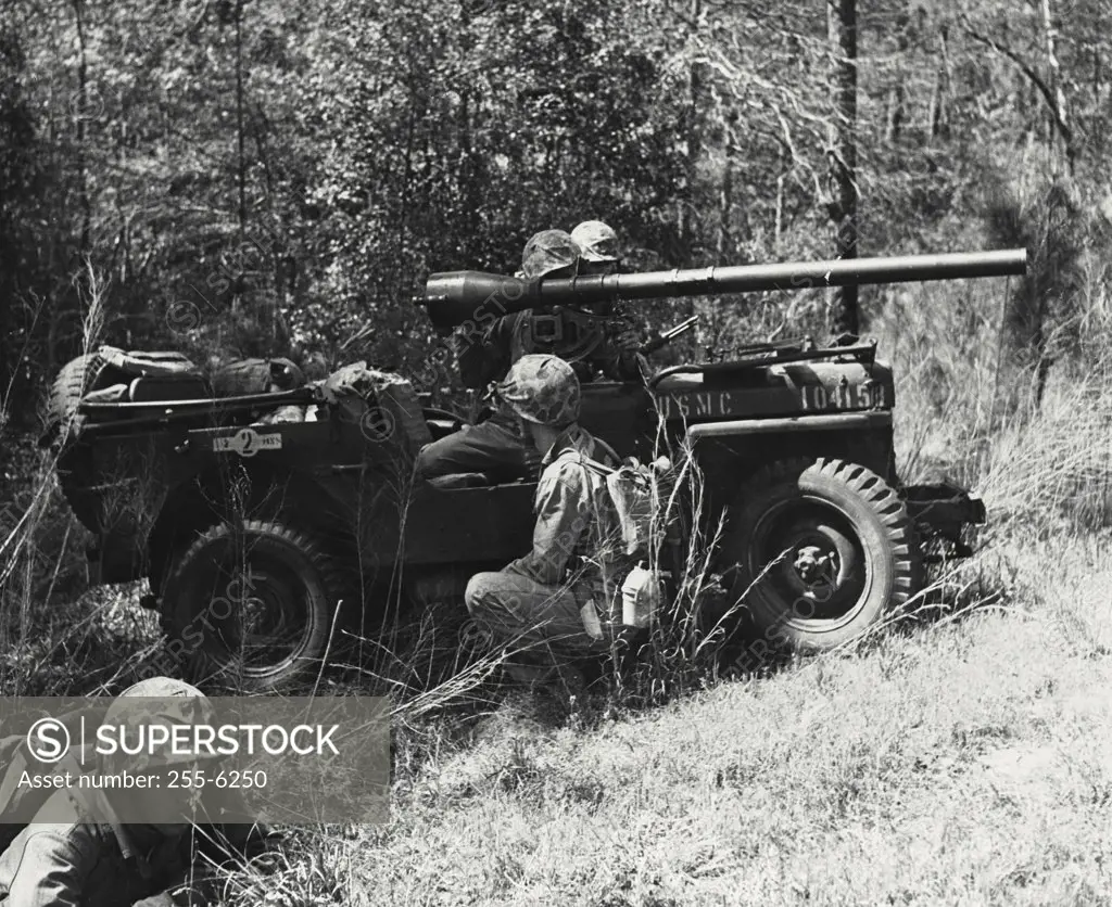 Vintage photograph. Marines and recoilless rifle aboard jeep