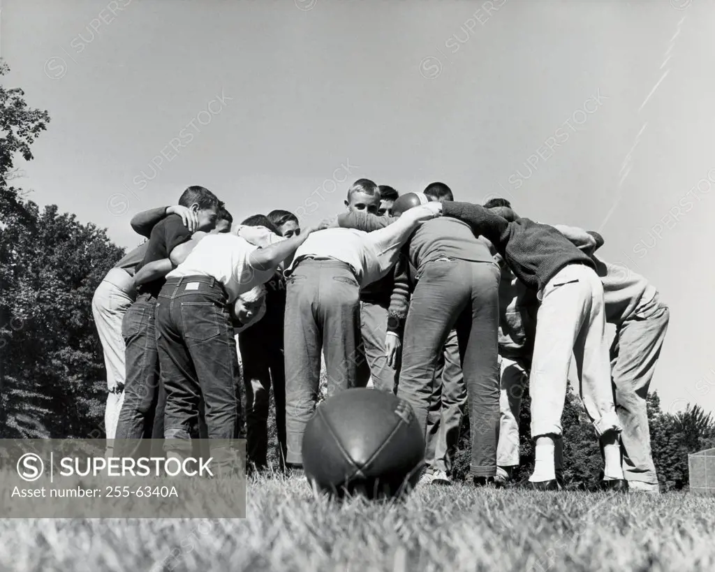 Group of boys standing in a huddle