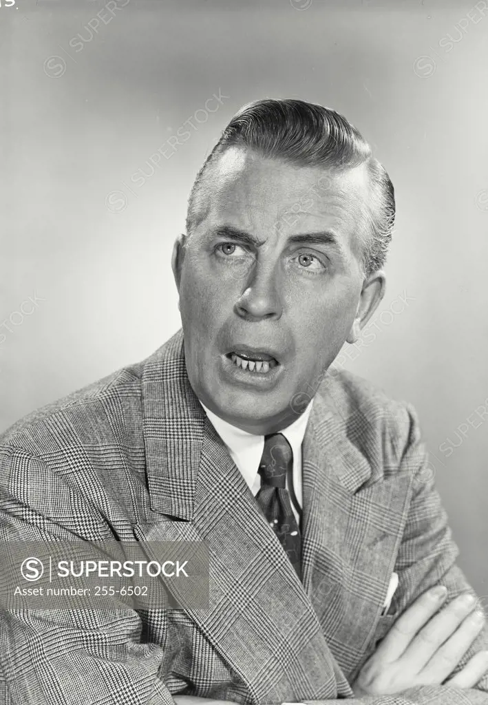Vintage photograph. Portrait of Businessman with comical expression.