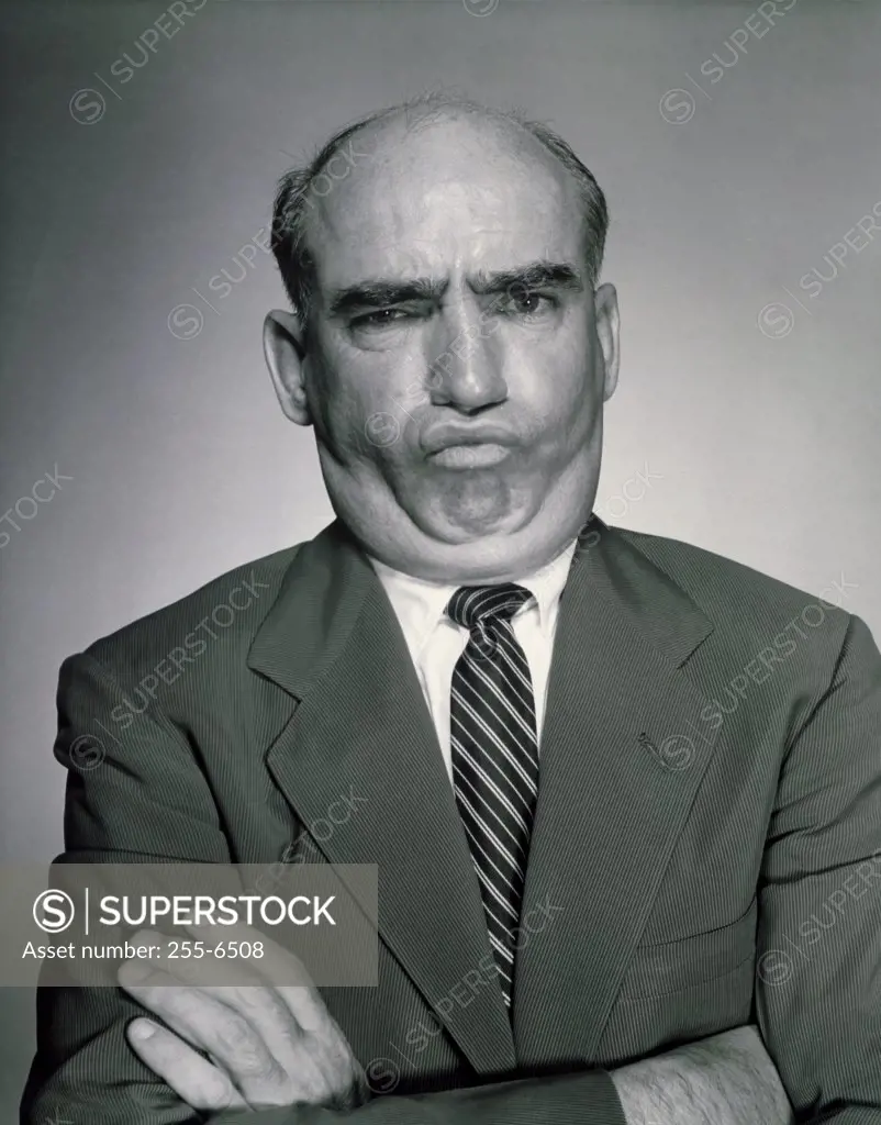 Portrait of mature man making face