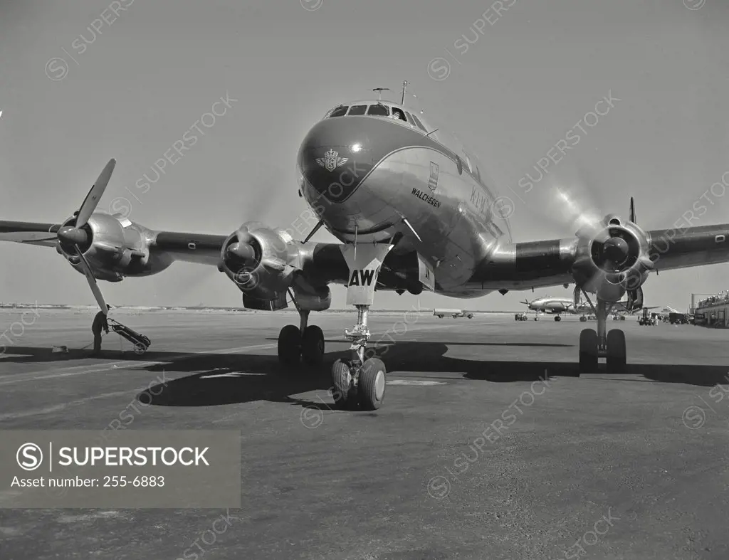 Vintage photograph. Starting and warming engines of constellation overseas airliner, of the KLM Dutch Airlines, in preparation for flight overseas.