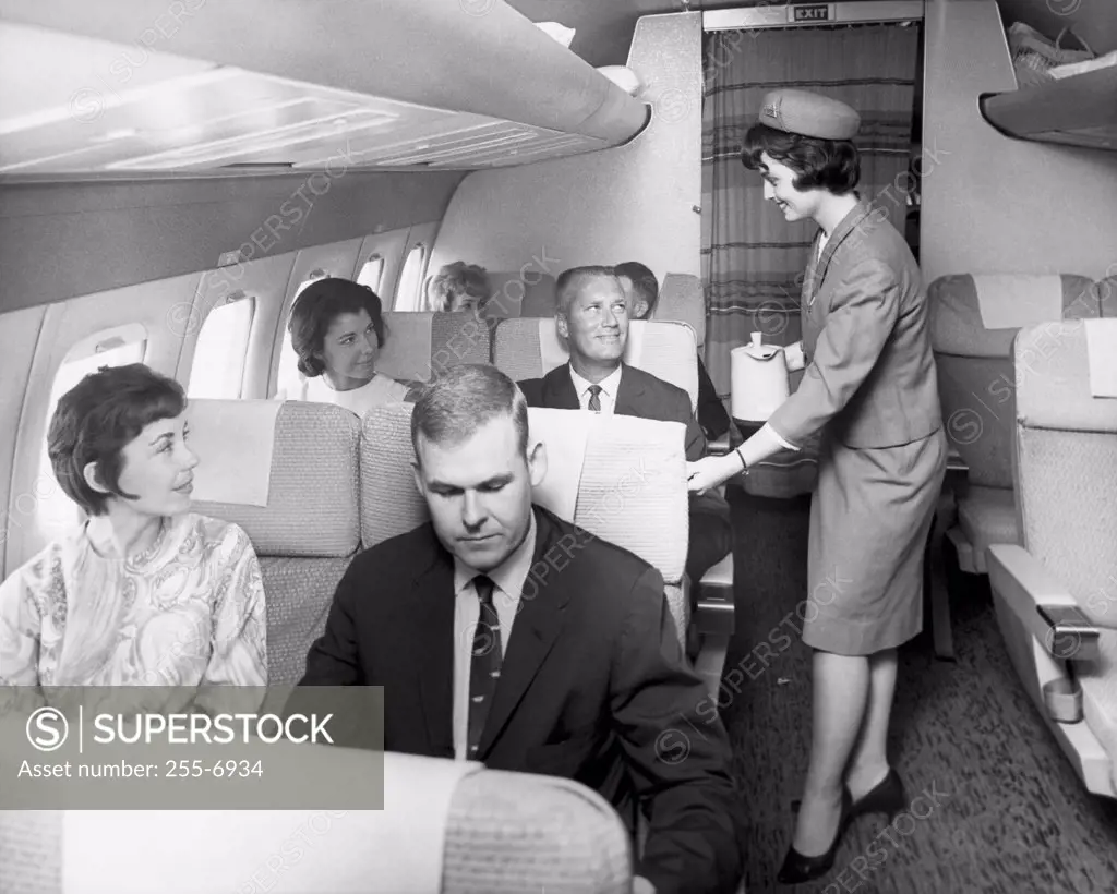 Stewardess serving passengers